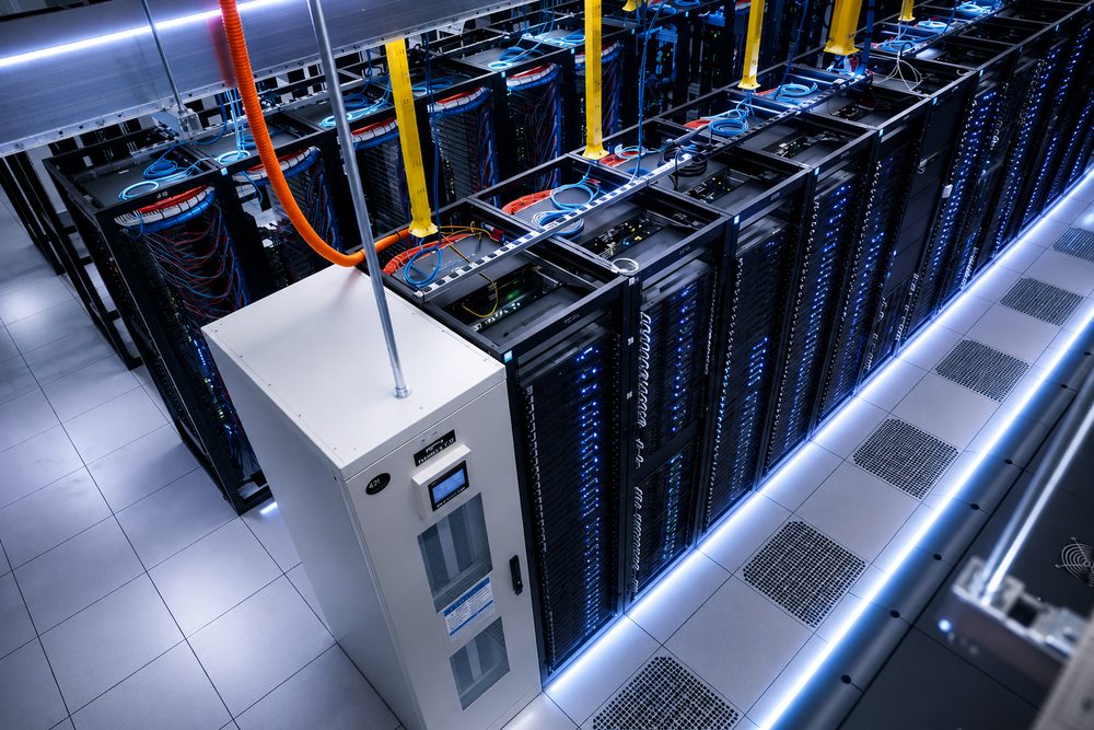 Overhead view of server racks and structured cabling in the Tampa, FL datacenter